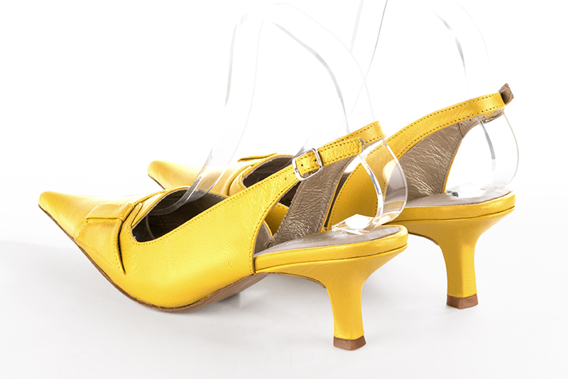Yellow women's slingback shoes. Pointed toe. Medium spool heels. Rear view - Florence KOOIJMAN